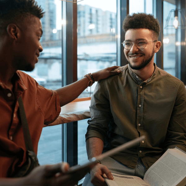 man encouraging other man